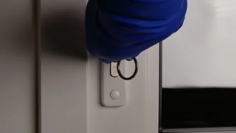 Insertion the key and unlocking the door Stock Footage 147074221