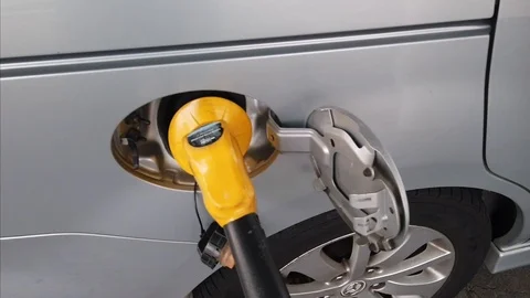 Insertion Of The Nozzle And Pumping Gasoline Into Vehicle At The Gas Station. Stock Footage 106671765