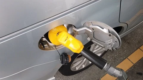 Insertion Of The Nozzle And Pumping Gasoline Into Vehicle At The Gas Station. Stock Footage 107445837