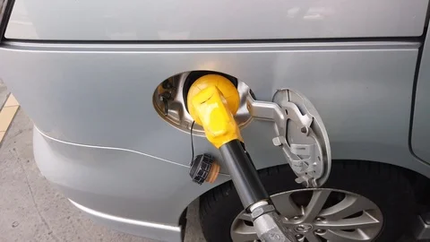 Insertion Of The Nozzle And Pumping Gasoline Into Vehicle At The Gas Station. Stock Footage 107445852