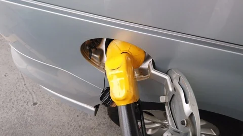 Insertion Of The Nozzle And Pumping Gasoline Into Vehicle At The Gas Station. Stock Footage 107445874