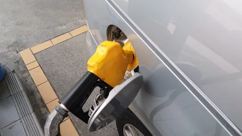 Insertion Of The Nozzle And Pumping Gasoline Into Vehicle At The Gas Station. Stock Footage 107445887