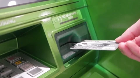 Inserts a bank card into an ATM 스톡 동영상 143265876