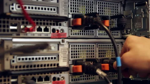 Inserts a power cord into a server Stock Footage 53063948