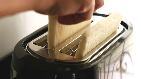 Inset two breads to toaster in morning 스톡 동영상 289439646