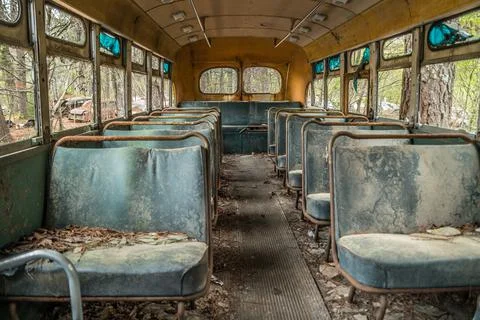 Inside of abandoned school bus Foto stock