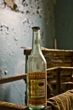 Inside the Abandoned Soviet canteen empty bottle of russian vodka Stock Photos