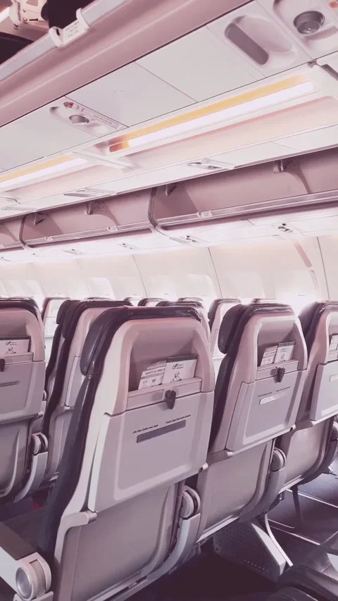 Inside Airbus A340 cabin view moving to Dubai Airport window Stock Footage 341800925