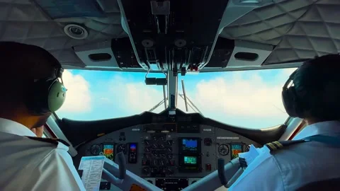 Inside the Aircraft flight deck. The pilots at work. View from airplane cockpit Stock Footage 239004772