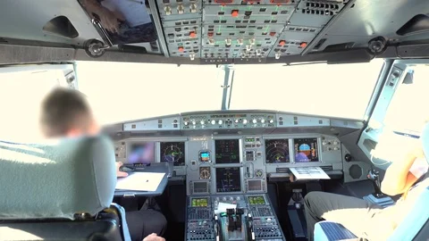 Inside of Airplane Cockpit with Pilots Stock Footage 94943062