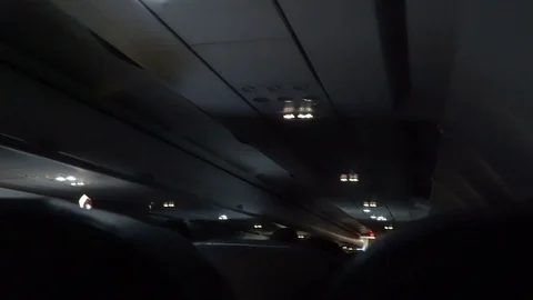 Inside airplane during night flight in storm Stock Footage 72896297