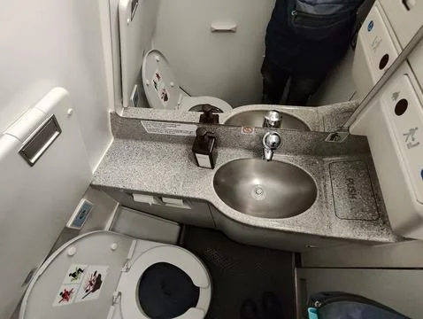 Inside Airplane lavatory Stock Photos