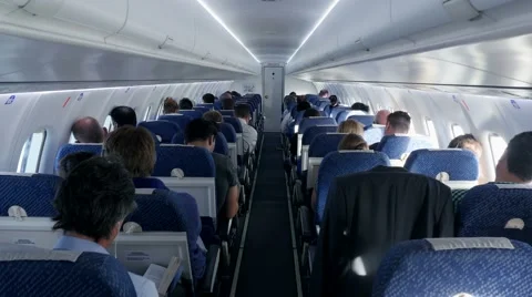 Inside airplane view. passengers sitting in airplane. people traveling. flight Stock Footage 40633609