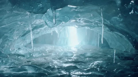 Inside an amazing ice cave with icicles and beautiful light. Turquise ice cave Stock Footage 144834589