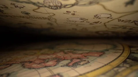 Inside an ancient book on cartography Stock Footage