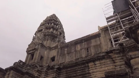 Inside Angor Wat, Aerial. Inside the main temple with scaffolding Stock Footage 116010744
