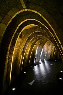 Inside an arch shaped tunnel built with bricks Foto stock