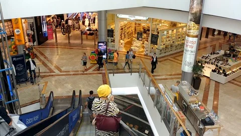 Inside Azrieli mall Tel-Aviv. Women talking on cell phone Video stock 97948108