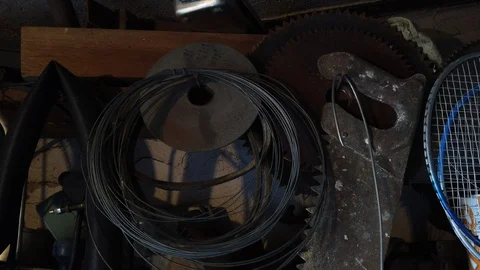 Inside the barn. Old trash on the shelves. Instruments. 動画素材 115787910