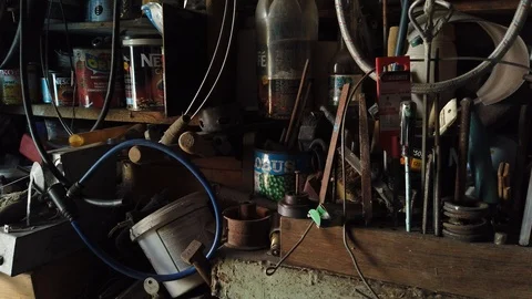 Inside the barn. On the shelves in the barn is all sorts of different trash - 2. 動画素材 117100654