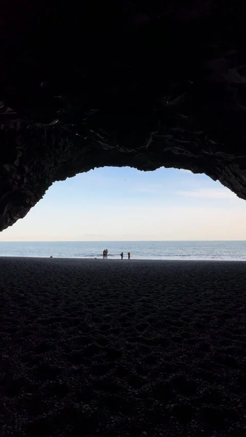 Inside the basalt column cave of Halsanefshellir on Reynisfjara black sand beach Video stock 332752980