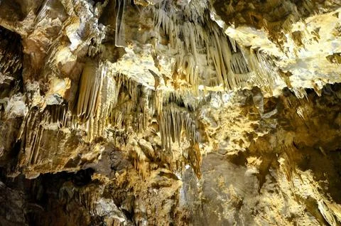 Inside of beautiful old dark cave with many stalactites. Grotte di Is Zudda.. Stock Photos