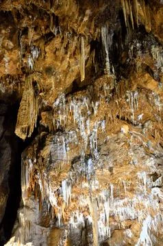 Inside of beautiful old dark cave with many stalactites. Grotte di Is Zudda.. Stock Photos