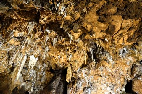 Inside of beautiful old dark cave with many stalactites. Grotte di Is Zudda.. Stock Photos