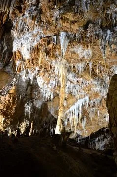 Inside of beautiful old dark cave with many stalactites. Grotte di Is Zudda.. Stock-Fotos