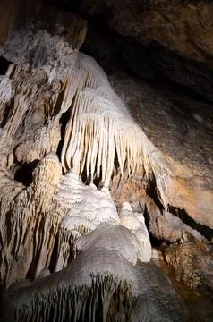 Inside of beautiful old dark cave with many stalactites. Grotte di Is Zudda.. Stock Photos