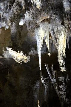 Inside of beautiful old dark cave with many stalactites. Grotte di Is Zudda.. Stock Photos