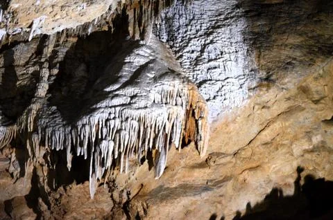 Inside of beautiful old dark cave with many stalactites. Grotte di Is Zudda.. Stock Photos