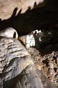 Inside of beautiful old dark cave with many stalactites. Grotte di Is Zudda.. Stock Photos