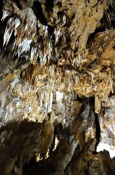 Inside of beautiful old dark cave with many stalactites. Grotte di Is Zudda.. Stock Photos