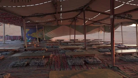 Inside of bedouin tent at sunset in a camp in the desert. Tourist excursions in Stock Footage 253660507