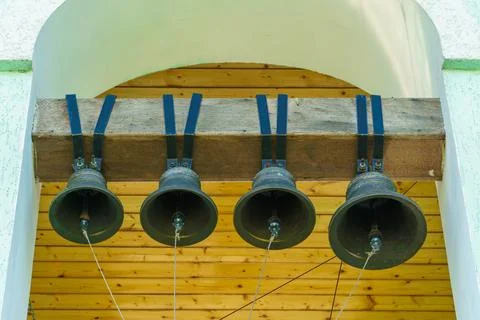 Inside the bell tower. A view from below of the big bell. An ancient red bric Stock Photos
