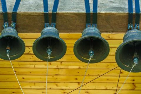 Inside the bell tower. A view from below of the big bell. An ancient red bric Stock Photos