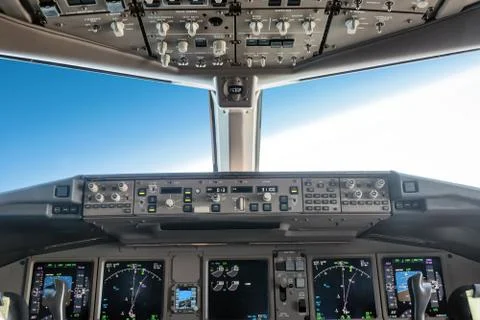 Inside a big jet flying plane cockpit Stock Photos