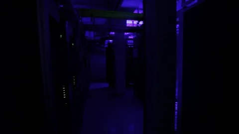 Inside a blue lit server room with nobody, data storage center, establish Stock Footage 237503126