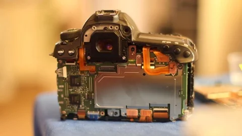 The inside of a broken DSLR camera Stock Footage 122940360