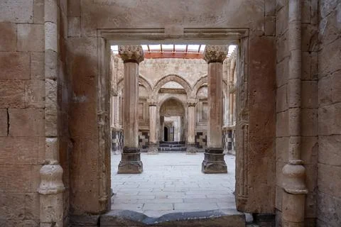 The inside of a building with arched windows and pillars. Ishakpasa palace .. Stock-Fotos