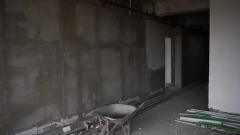 Inside the building under construction. Concrete walls and building tools Stock Footage 271571202