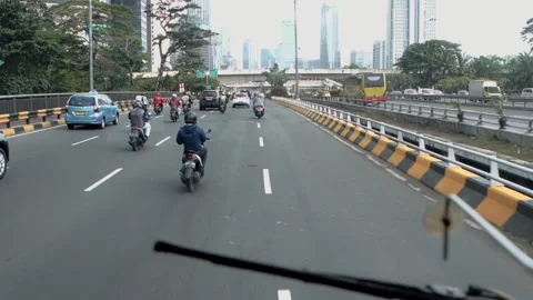 Inside the bus front seat around Jakarta street, Capitol of Indonesia. Video stock 172393435