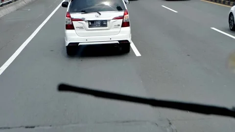 Inside the bus front seat around Jakarta street, Capitol of Indonesia. Stock Footage 172397134