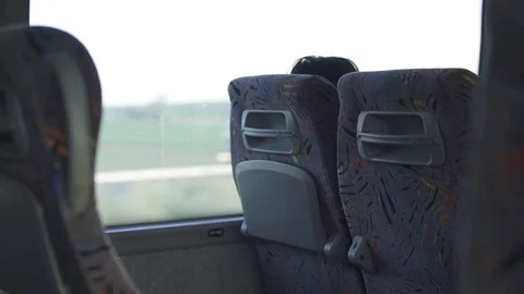 Inside a bus going on a highway - empty seats Stock Footage 88730809
