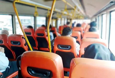 Inside the bus with passengers from back view Stock Photos