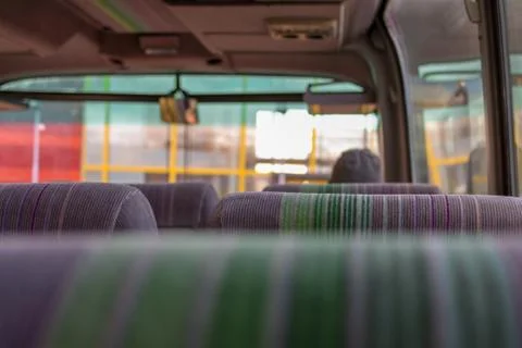 The inside of a bus, with the perspective of a passenger Stock Photos