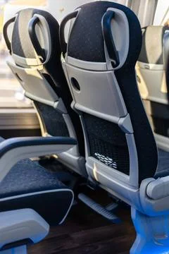 Inside the bus, two comfortable seats are positioned side by side, providing  Stock Photos