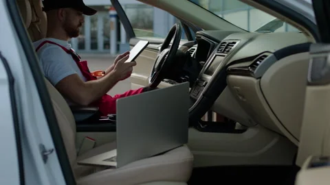 Inside cabin of malfunctioning car mechanic commenced diagnostic procedure Stock Footage 272159899