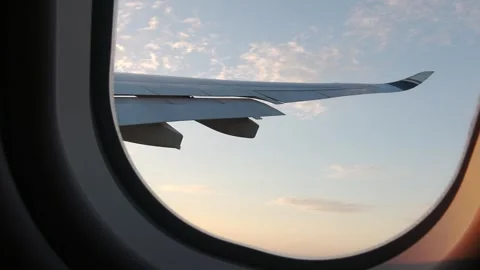 Inside the cabin: The plane turns left, providing an aerial view of the ground. Stock Footage 317273407